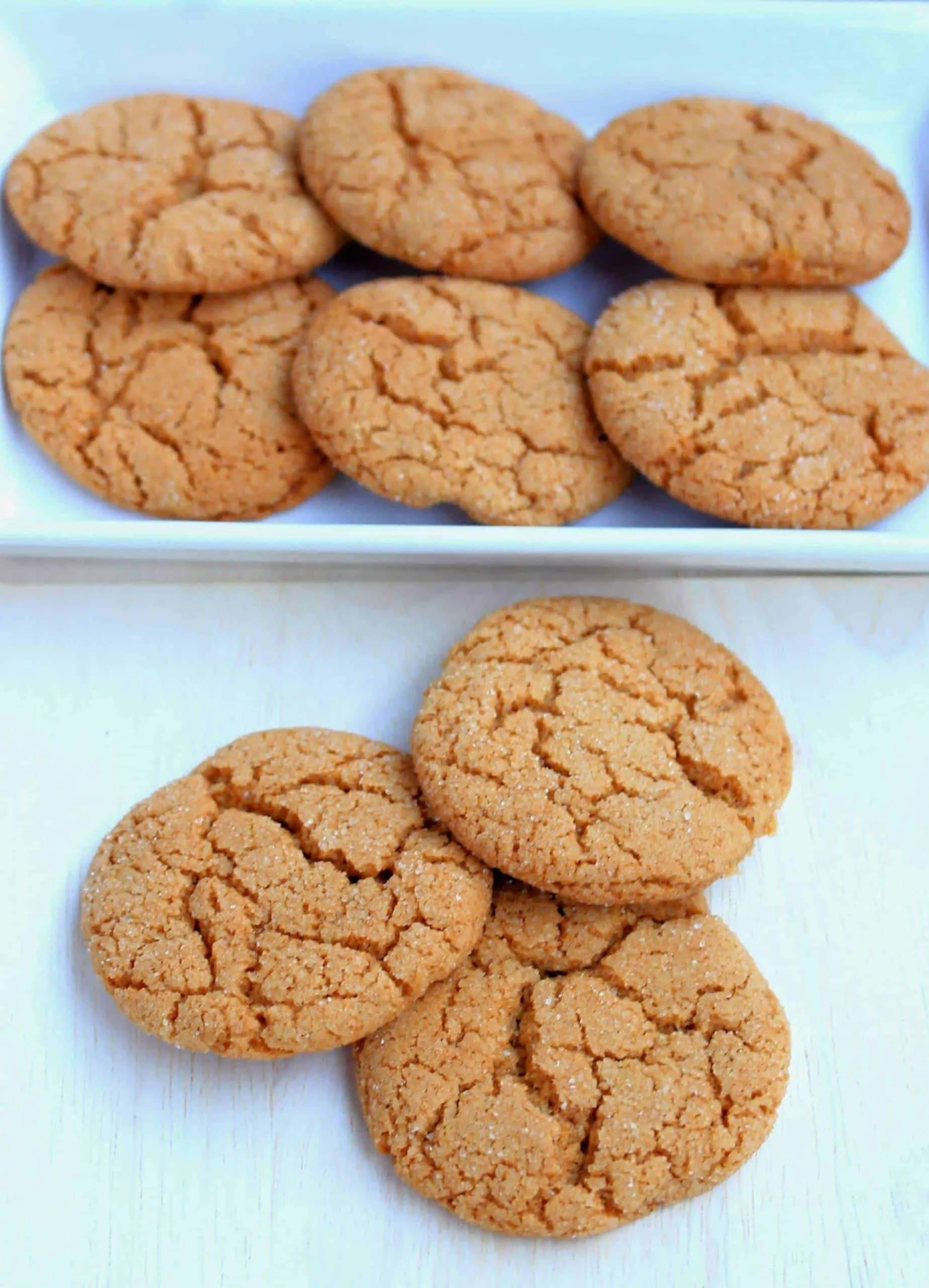 Old-fashioned ginger cookies arranged on a wooden board.