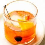 Muddling Sugar Cube with Bitters for an Old Fashioned