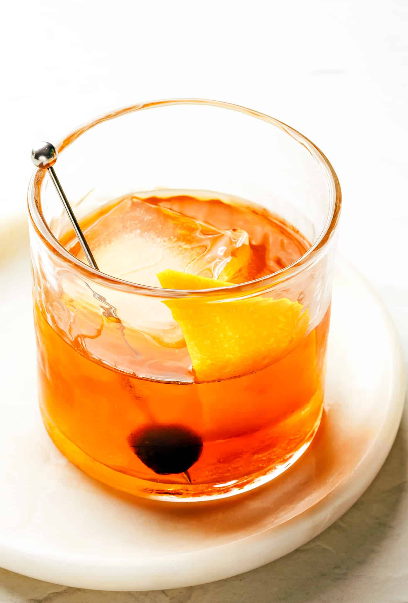 Muddling Sugar Cube with Bitters for an Old Fashioned