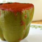 Old Fashioned Stuffed Bell Peppers recipe is a simple stuffed pepper recipe with cooked rice and ground beef. With only five ingredients, including a simple tomato sauce, this basic recipe is anything but simple in flavor.
