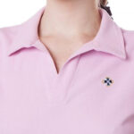 Man in a pink pastel polo shirt, bone-colored slacks and a navy blue cardigan