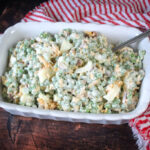 Peas salad prepared in a white serving bowl