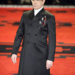 Gary Oldman embodying villainous charm on the Prada runway at the Autumn/Winter 2012 fashion show during Milan Menswear Fashion Week.