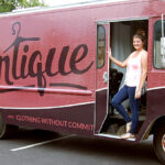 Brandi King stands in front of the Rentique truck