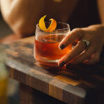 Peach Old Fashioned with a peach slice garnish