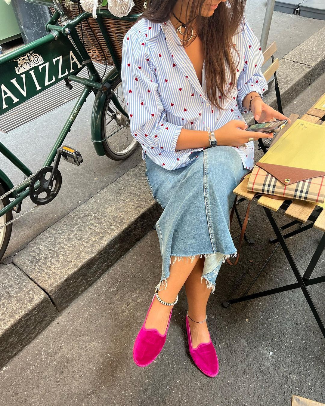 Street style image in Milan featuring Friulane shoes, a popular footwear choice.
