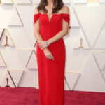 Jennifer Garner casual style inspiration: zip-up jacket, camo pants, red sneakers, gold necklaces, brown shades