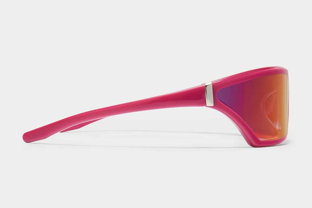 Side view of bright pink neon sunglasses frame with pink tinted lenses