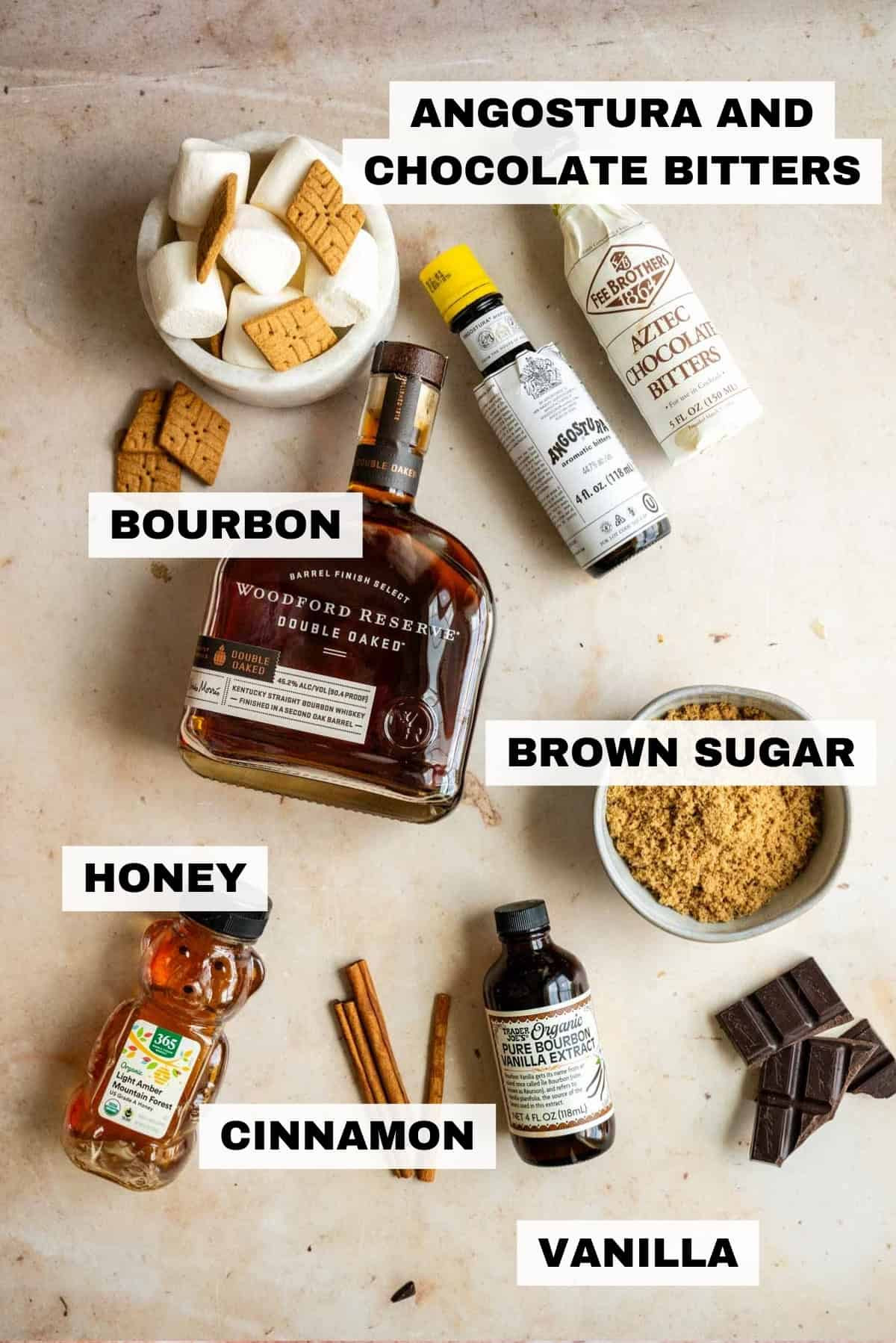 Ingredients for s'mores old fashioned, including bourbon, syrup, bitters, and marshmallows
