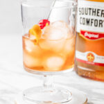 Southern Comfort Old Fashioned with orange peel and cherry garnish