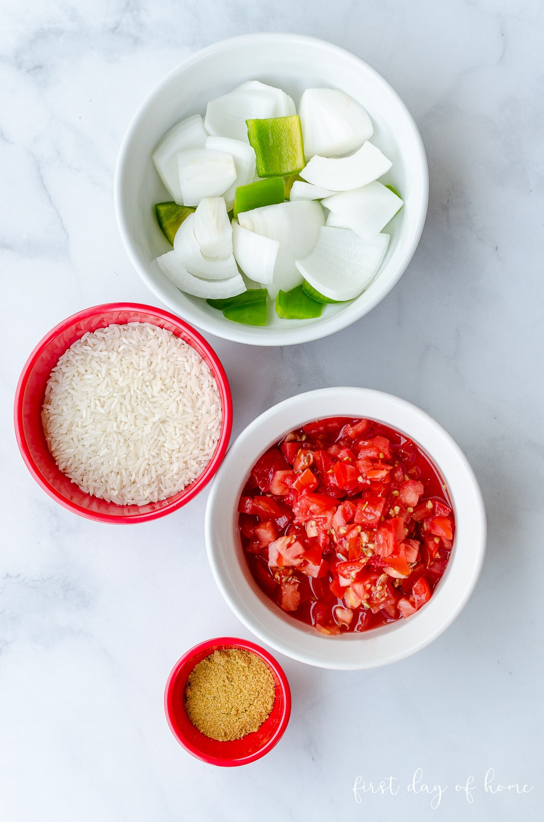 Chopped tomatoes, onions, bell pepper, and garlic for Spanish rice