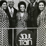 The Staple Singers and Don Cornelius, second from right, on Soul Train. Publicity photo taken during production of the June 8, 1974 episode (season 3, episode 35). Public Domain Image.