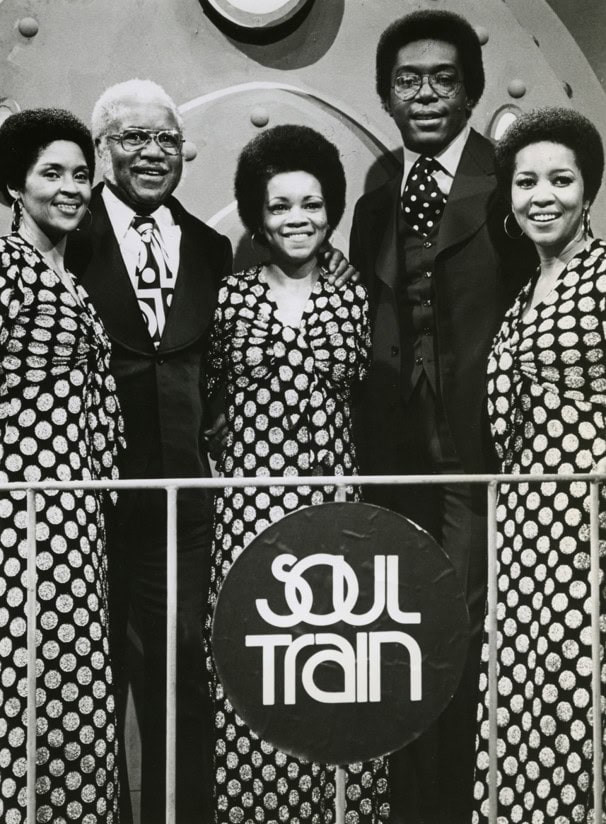 The Staple Singers and Don Cornelius, second from right, on Soul Train. Publicity photo taken during production of the June 8, 1974 episode (season 3, episode 35). Public Domain Image.
