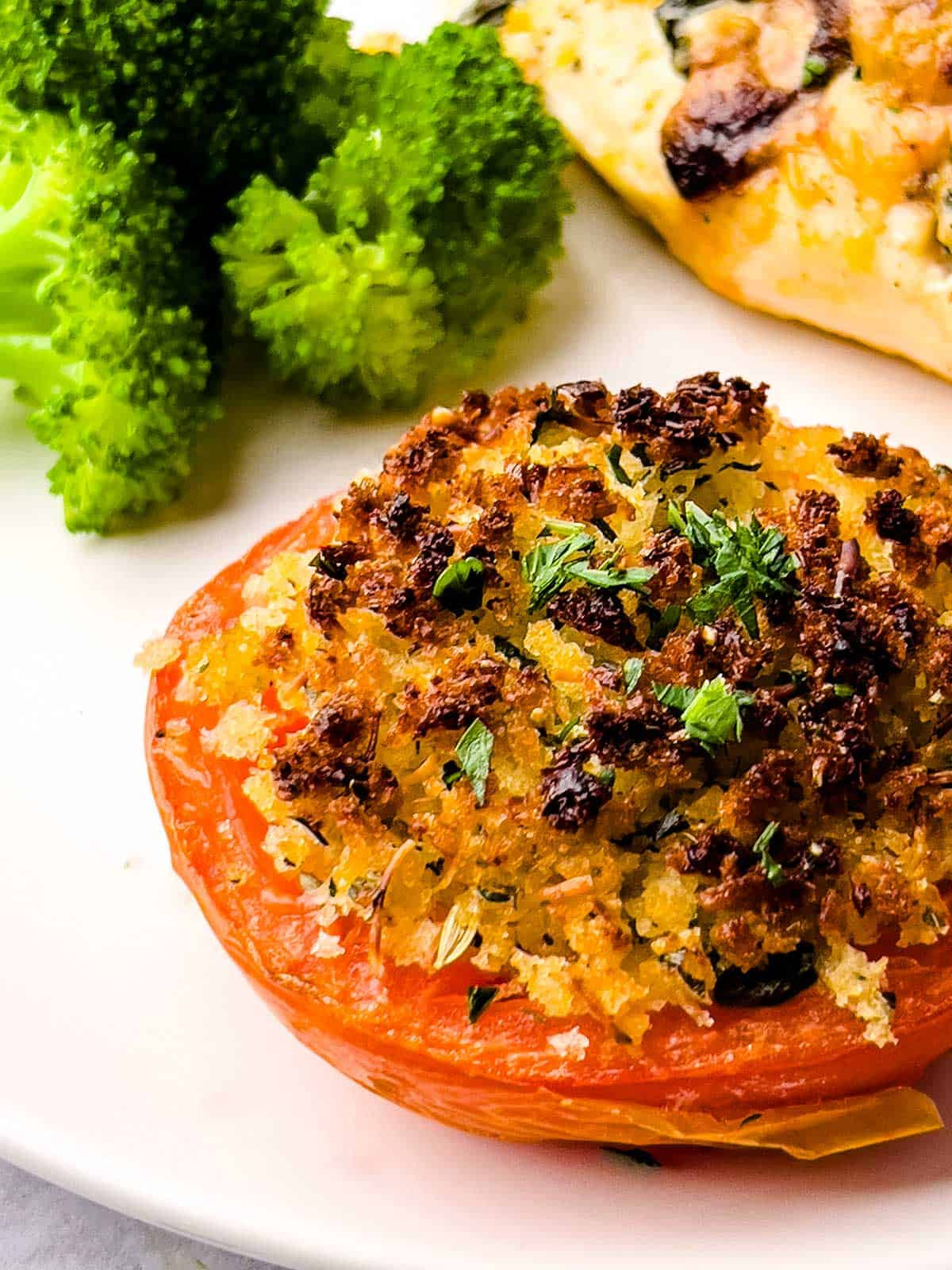 Old-fashioned stuffed tomatoes with breadcrumbs and herbs