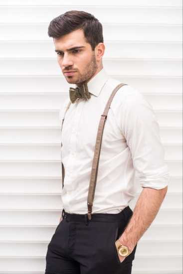 Stylish man wearing brown suspenders and a gold watch