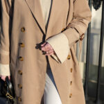 Man wearing a stylish beige trench coat