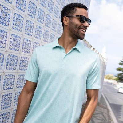 alt text: Relaxed man wearing TravisMathew casual wear at Fashion Mall Keystone