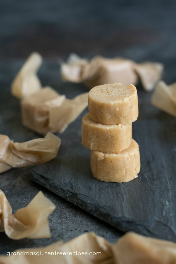 Stacked old fashioned peanut butter candy wrapped in wax paper