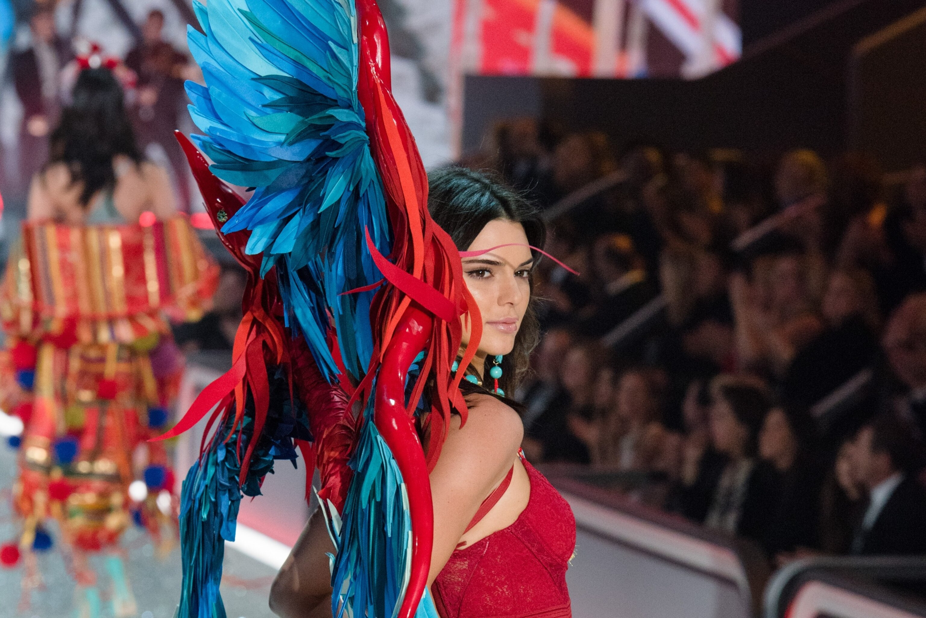 Kendall Jenner walks the runway at the 2016 Victoria's Secret Fashion Show in Paris, showcasing a blend of confidence and style that captivated audiences worldwide.