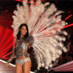 Brazilian model Adriana Lima walks the runway at the 2018 Victoria's Secret Fashion Show, showcasing confidence and beauty, an inspiration for both men and women to embrace their bodies.