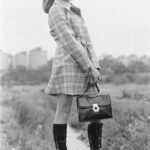 70s fashion - model with plaid and boots