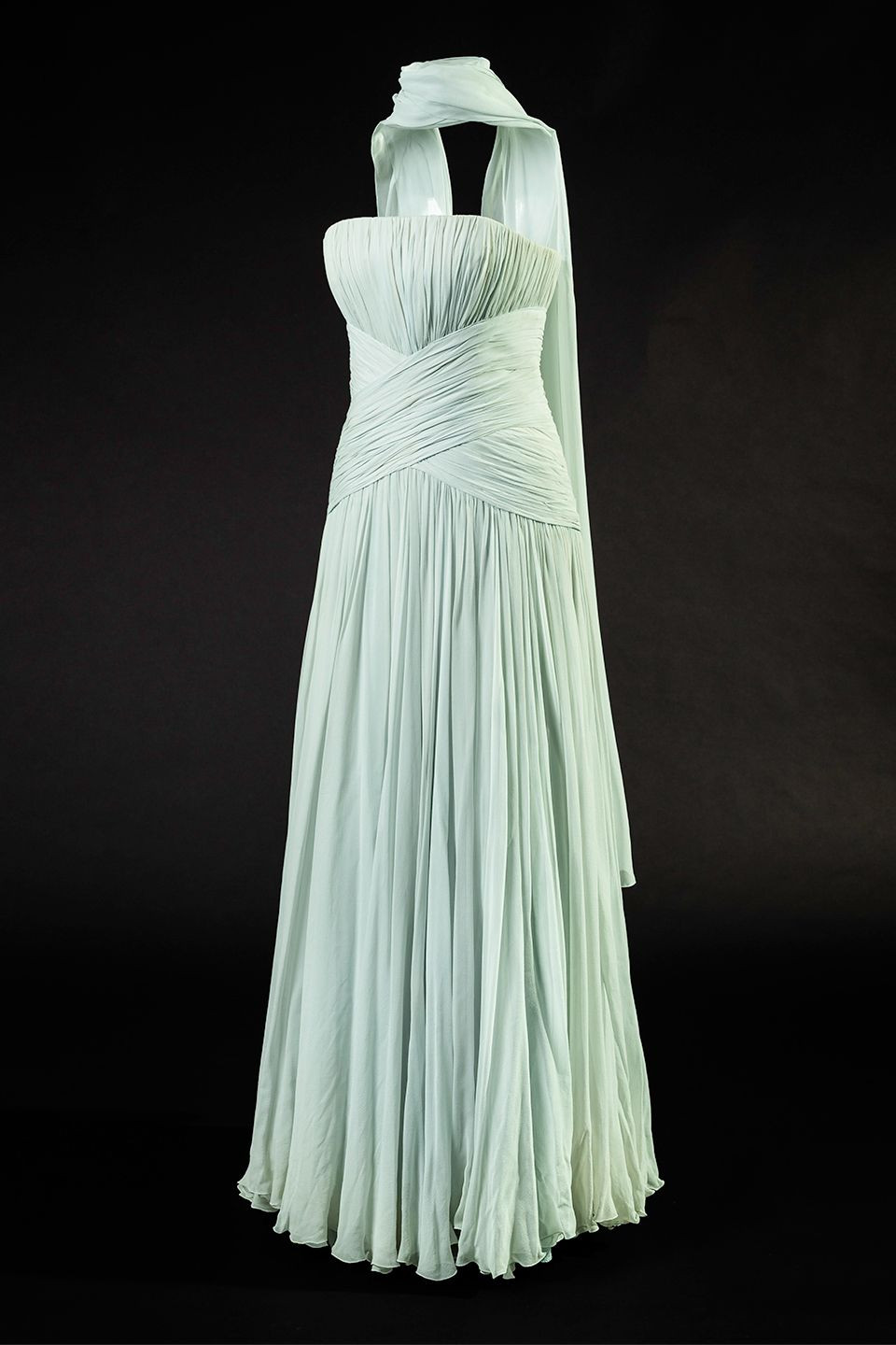 Princess Diana's early style featuring a pastel dress with ruffles, epitomizing her "Shy Di" phase
