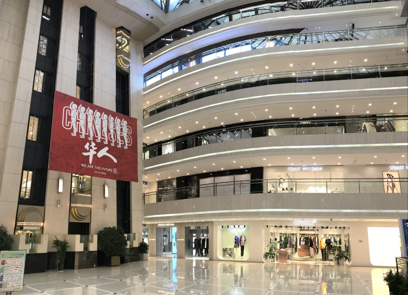 A display of traditional Chinese clothing and accessories in a boutique setting.