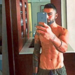 Virat Kohli in a swimming pool, soaked in self-consciousness, eyes shut, hands stroking back wet hair, showcases virility in Bond girl style