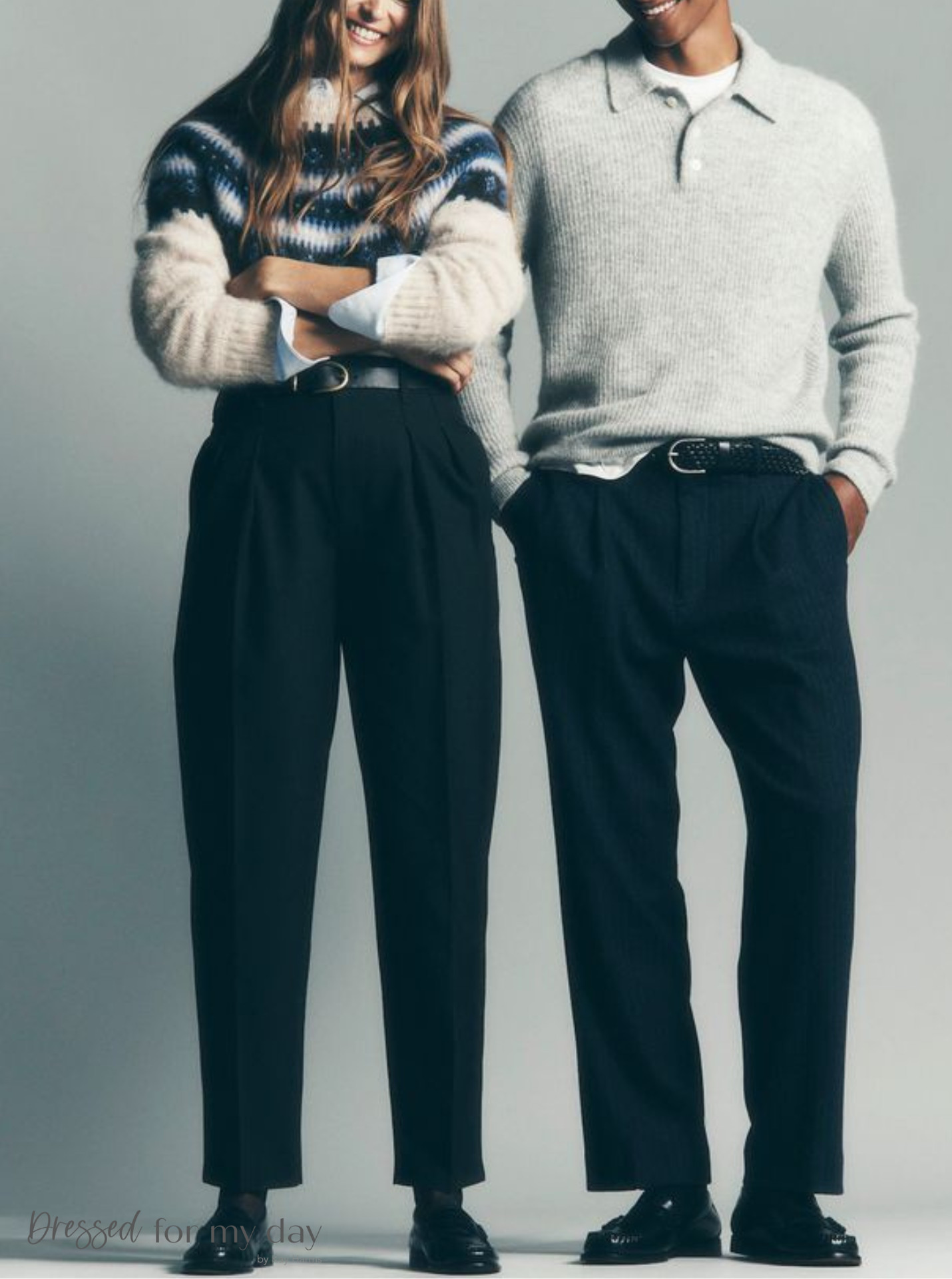 alt text: Men's tailored navy overcoat paired with a gray turtleneck and dark trousers, exuding classic winter elegance