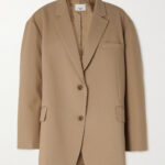 Man wearing a stylish blazer, embodying Madrid fashion.
