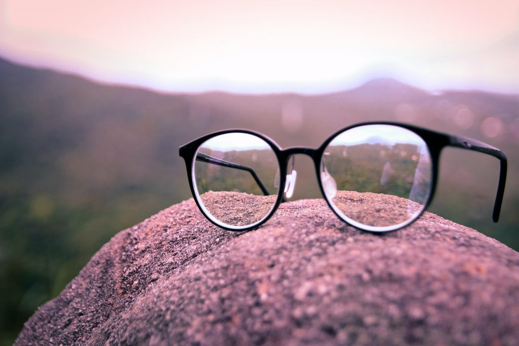 Man wearing non-prescription glasses with a focused expression